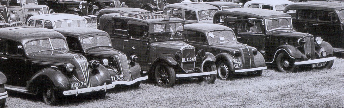 Anything goes - a mixed bunch of cars, all with differing styles of blackout precautions. The scene is at the carpark of the Derby 1941 which was held at Newmarket instead of Espom during the war
